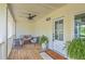 Cozy porch featuring comfortable seating, ceiling fan, and a 'Welcome' doormat at 1685 Old Military Rd, Charleston, SC 29412