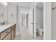 Bright bathroom featuring a modern vanity with granite countertop and a separate toilet room at 177 Grange Cir, Summerville, SC 29486