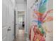 Hall bathroom with tile flooring and a colorful shower curtain at 183 Calm Water Way, Summerville, SC 29486