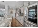 Modern kitchen with stainless steel appliances and gray cabinets with contrasting countertops at 183 Calm Water Way, Summerville, SC 29486