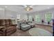 Living room featuring gray furniture, neutral walls, and a colorful rug on the floor at 183 Calm Water Way, Summerville, SC 29486