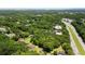 An aerial view of a lush, green residential neighborhood near the highway and local businesses at 1879 Richmond St, Charleston, SC 29407