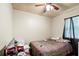 Bedroom with a single bed, a ceiling fan, and curtains by the window at 1879 Richmond St, Charleston, SC 29407