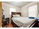 Bedroom featuring a bed with white bedding and a dark wood headboard at 1879 Richmond St, Charleston, SC 29407