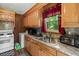 Kitchen featuring oak cabinets, stainless steel sink, and modern appliances at 1879 Richmond St, Charleston, SC 29407