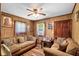 Comfortable living room with wood paneling, cozy sofas, and natural light, creating a warm and inviting space at 1879 Richmond St, Charleston, SC 29407