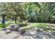 Spacious backyard with patio furniture, a shed, and mature trees offering shade at 208 Janice St, Goose Creek, SC 29445