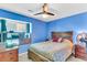 Comfortable bedroom with a ceiling fan, natural light, and neutral carpet at 208 Janice St, Goose Creek, SC 29445