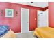 Bedroom with neutral carpeting, a white door, and a decorative picture on the wall at 208 Janice St, Goose Creek, SC 29445