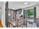 Bright dining area with a wooden table, chairs, and sliding glass doors to the outdoor patio at 208 Janice St, Goose Creek, SC 29445