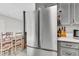 A modern stainless steel refrigerator complements the cabinets in this home's kitchen at 208 Janice St, Goose Creek, SC 29445