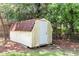 Exterior shot of a weathered shed with a red shingled roof and a white painted door at 208 Janice St, Goose Creek, SC 29445