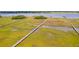 Expansive marsh view featuring boardwalks leading to private boat docks on the waterfront at 2312 Rushland Landing Rd, Johns Island, SC 29455