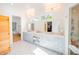 Elegant primary bathroom with double vanity, ample storage, walk in shower, and access to a sauna at 2312 Rushland Landing Rd, Johns Island, SC 29455