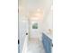 Charming bathroom with stylish blue vanity and marble tile floors at 2312 Rushland Landing Rd, Johns Island, SC 29455