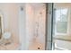 Beautiful bathroom featuring marble tile in the shower and penny tile flooring at 2312 Rushland Landing Rd, Johns Island, SC 29455