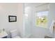 Bright bathroom with large window overlooking a lake has white subway tile shower with glass door at 2312 Rushland Landing Rd, Johns Island, SC 29455