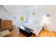Bright bedroom with white walls and plenty of natural light has hardwood floors and ceiling fan at 2312 Rushland Landing Rd, Johns Island, SC 29455