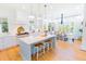 Bright, spacious kitchen with stainless appliances, island with seating and adjacent dining area at 2312 Rushland Landing Rd, Johns Island, SC 29455