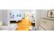 Bright main bedroom with hardwood floors, a seating area, and a view into the ensuite bathroom at 2312 Rushland Landing Rd, Johns Island, SC 29455