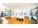 Spacious main bedroom with hardwood floors, ensuite sitting area, ample natural light, and a serene ambiance at 2312 Rushland Landing Rd, Johns Island, SC 29455