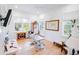 Bright office features hardwood floors, a ceiling fan, and multiple windows providing plenty of natural light at 2312 Rushland Landing Rd, Johns Island, SC 29455
