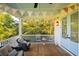 Inviting porch with wicker seating and a view of the lush greenery at 2312 Rushland Landing Rd, Johns Island, SC 29455