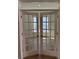 Elegant French doors with glass panels offering a view into a sunlit room at 235 Denham St, Summerville, SC 29486