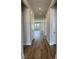 Inviting hallway featuring wood floors and natural light, leading to the living areas at 235 Denham St, Summerville, SC 29486