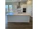Kitchen island with ample counter space, sink, and bar seating at 235 Denham St, Summerville, SC 29486