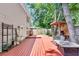 Backyard with multi-tiered wooden deck featuring a firepit table, barbecue and fountain at 2773 Forest Dew Ct, Charleston, SC 29414