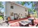 Backyard with a wooden deck featuring a firepit table and various patio decor at 2773 Forest Dew Ct, Charleston, SC 29414