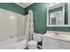 Bathroom features a tub, toilet, shower with lemon-themed curtain and single sink vanity at 2773 Forest Dew Ct, Charleston, SC 29414