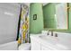 Bathroom features a tub, toilet, shower with lemon-themed curtain and single sink vanity at 2773 Forest Dew Ct, Charleston, SC 29414
