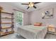 Cozy bedroom featuring a ceiling fan, window, and stylish decor at 2773 Forest Dew Ct, Charleston, SC 29414