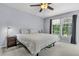 Bedroom with neutral colored carpet and walls, complemented by a window with views and curtains at 2773 Forest Dew Ct, Charleston, SC 29414