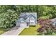 Charming two-story home featuring light blue siding, well-maintained landscaping, and an attached garage at 2773 Forest Dew Ct, Charleston, SC 29414