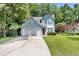 Charming home exterior with a well-maintained lawn, driveway, and beautiful curb appeal at 2773 Forest Dew Ct, Charleston, SC 29414