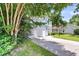 Home exterior featuring a well-manicured lawn, driveway, and attached garage at 2773 Forest Dew Ct, Charleston, SC 29414