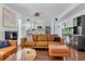 Living room with seating area, decor, fireplace, and view into modern kitchen at 2773 Forest Dew Ct, Charleston, SC 29414