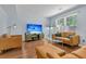 Spacious living room with wood floors, plenty of natural light, and modern furnishings at 2773 Forest Dew Ct, Charleston, SC 29414