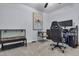 Home office with gaming setup, neutral carpet, artwork and reptile terrarium at 2773 Forest Dew Ct, Charleston, SC 29414