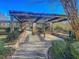 The pool entrance is fenced and features an arbor and shade from the many bushes planted around it at 2773 Forest Dew Ct, Charleston, SC 29414