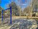 The swing set, made of blue metal, is ready for children to enjoy in the neighborhood park at 2773 Forest Dew Ct, Charleston, SC 29414