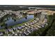 Sprawling community viewed from above, showcasing beautiful lakes, tree-lined streets, and well-maintained homes at 292 Calm Water Way, Summerville, SC 29486