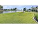 Expansive backyard with lake views and well-maintained lawn at 292 Calm Water Way, Summerville, SC 29486
