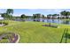 Large, grassy backyard with lake frontage and mature trees at 292 Calm Water Way, Summerville, SC 29486