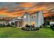 Tranquil backyard featuring a patio, dining set, and screened porch at 292 Calm Water Way, Summerville, SC 29486