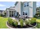 Spacious backyard with a patio and lush landscaping, perfect for outdoor entertaining at 292 Calm Water Way, Summerville, SC 29486