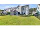 Charming backyard featuring a screen porch, patio, and well-manicured lawn at 292 Calm Water Way, Summerville, SC 29486